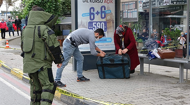 Çöpe atacağı valizi otobüs durağına bırakınca polisler alarma geçti