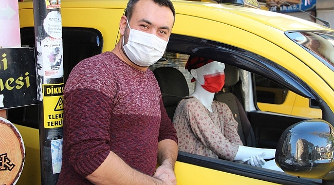 Taksiciden korona virüse cansız mankenli önlem