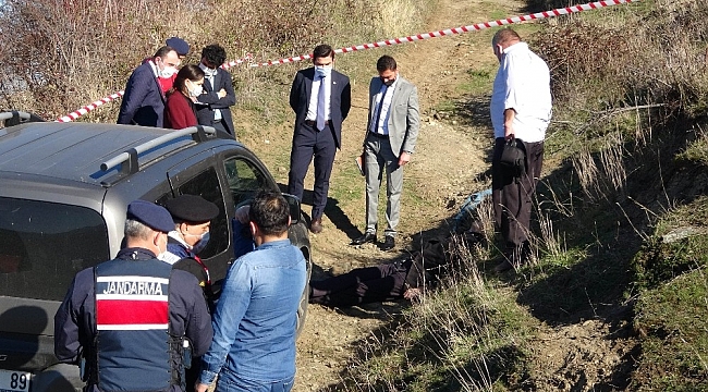 Aracının yanında tabancayla alnından vurulmuş halde bulundu