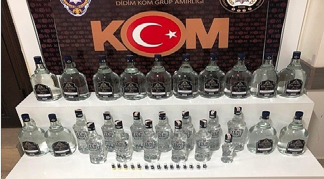 Didim'de sahte içki ve kaçak cep telefonu operasyonu