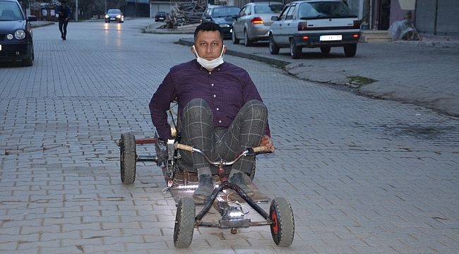 Tahtadan yaptığı arabayla sürücülere rakip oldu