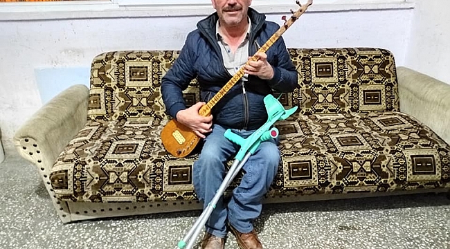 Tomarzalı engelli vatandaş ilçesine şarkı yazdı