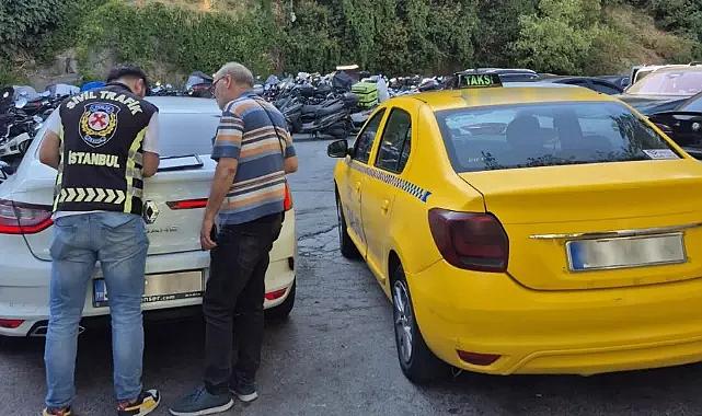 'Seyir halinde at yarışı kuponu dolduran' taksicinin aracı trafikten men edildi